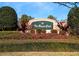 The Royal Club community entrance with lush landscaping at 3667 Kingswood Ct, Clermont, FL 34711