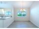 Bright dining area with modern chandelier at 3667 Kingswood Ct, Clermont, FL 34711