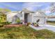 Single-story home with attached garage and well-manicured lawn at 3667 Kingswood Ct, Clermont, FL 34711