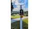 Golf cart crossing sign with directional arrow at 3667 Kingswood Ct, Clermont, FL 34711