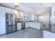 Modern kitchen with stainless steel appliances and granite countertops at 3667 Kingswood Ct, Clermont, FL 34711
