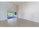 Bright living room with vaulted ceiling and sliding glass doors at 3667 Kingswood Ct, Clermont, FL 34711