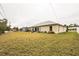 Large backyard with grassy area and patio at 459 Abeno Ave, Deltona, FL 32725
