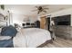 Spacious main bedroom with large TV, dresser, and sliding barn door at 459 Abeno Ave, Deltona, FL 32725