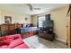 Bedroom with wood dresser, tv and a comfortable bed at 459 Abeno Ave, Deltona, FL 32725