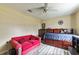 Bedroom with a sofa and a wooden bed frame at 459 Abeno Ave, Deltona, FL 32725