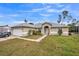 One-story house with attached garage, driveway, and well-maintained lawn at 459 Abeno Ave, Deltona, FL 32725
