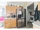 Stainless steel refrigerator and light wood cabinets in this kitchen at 459 Abeno Ave, Deltona, FL 32725