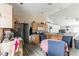 Kitchen with light wood cabinets, stainless steel appliances, and a dining area at 459 Abeno Ave, Deltona, FL 32725