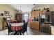 Eat-in kitchen with wood cabinets, stainless steel appliances, and breakfast nook at 459 Abeno Ave, Deltona, FL 32725