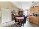 Bright kitchen with wood cabinets and a dining area at 459 Abeno Ave, Deltona, FL 32725