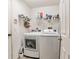 Convenient laundry room with washer, dryer, and shelving at 459 Abeno Ave, Deltona, FL 32725