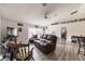 Spacious living room with leather couches and wood-look floors at 459 Abeno Ave, Deltona, FL 32725