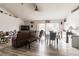 Living and dining area with hardwood floor, brown couch and dining table at 459 Abeno Ave, Deltona, FL 32725