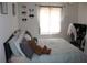 Bright bedroom with a comfortable bed and plenty of pillows at 5271 Images Cir # 108, Kissimmee, FL 34746