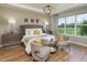 Spacious main bedroom with large windows and sitting area at 5296 Bowspirit Way, St Cloud, FL 34769