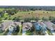 Aerial view of houses with solar panels and a large surrounding area at 590 Michigan Estates Cir, St Cloud, FL 34769