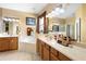 Luxurious bathroom with double sinks, a soaking tub, and separate shower at 590 Michigan Estates Cir, St Cloud, FL 34769