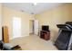 Spacious bedroom with large TV, treadmill and plenty of floor space at 590 Michigan Estates Cir, St Cloud, FL 34769