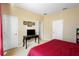 Elegant bedroom with a king-size bed, and a vanity with a mirror at 590 Michigan Estates Cir, St Cloud, FL 34769