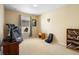 Bright bedroom with treadmill, bookshelves, and ample natural light at 590 Michigan Estates Cir, St Cloud, FL 34769