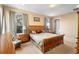 Bright Primary bedroom with a king-size bed and patio access at 590 Michigan Estates Cir, St Cloud, FL 34769