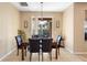 Casual dining area with a granite table and dark leather chairs, near sliding doors at 590 Michigan Estates Cir, St Cloud, FL 34769