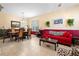 Dining area with wood table and chairs, adjacent to living room at 590 Michigan Estates Cir, St Cloud, FL 34769