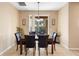 Casual dining area with a granite table and dark leather chairs, near sliding doors at 590 Michigan Estates Cir, St Cloud, FL 34769