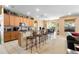 Kitchen boasts wood cabinets, granite countertops, and a breakfast bar with seating at 590 Michigan Estates Cir, St Cloud, FL 34769