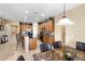Open kitchen with an island, granite countertops, and stainless steel appliances at 590 Michigan Estates Cir, St Cloud, FL 34769
