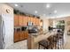 Well-equipped kitchen with light wood cabinets and a breakfast bar at 590 Michigan Estates Cir, St Cloud, FL 34769