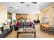 Open floor plan with a combined living and kitchen area, showcasing a breakfast bar and dining area at 590 Michigan Estates Cir, St Cloud, FL 34769