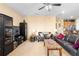 Bright living room featuring a comfy seating area and built-in entertainment center at 590 Michigan Estates Cir, St Cloud, FL 34769