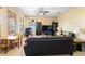 Spacious living room with ample natural light, leather sofas, and a large TV at 590 Michigan Estates Cir, St Cloud, FL 34769
