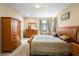Bright and airy main bedroom, featuring a king-size bed and ample closet space at 590 Michigan Estates Cir, St Cloud, FL 34769
