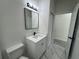 Bathroom with vanity, toilet and marble-look flooring at 702 Marion Oaks Manor, Ocala, FL 34473