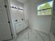 Double vanity bathroom with modern light fixtures at 702 Marion Oaks Manor, Ocala, FL 34473
