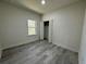 Simple bedroom with grey flooring and a closet at 702 Marion Oaks Manor, Ocala, FL 34473