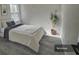 Cozy bedroom with a queen bed and grey flooring at 702 Marion Oaks Manor, Ocala, FL 34473