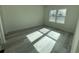 Well-lit bedroom featuring grey wood-look flooring at 702 Marion Oaks Manor, Ocala, FL 34473