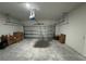 Garage with overhead door and storage space at 702 Marion Oaks Manor, Ocala, FL 34473