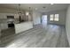 Modern kitchen with white cabinets, stainless steel appliances, and a kitchen island at 702 Marion Oaks Manor, Ocala, FL 34473