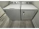 Laundry room with white Whirlpool washer and dryer at 702 Marion Oaks Manor, Ocala, FL 34473