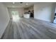 Bright and spacious living room with an open floor plan and stylish flooring at 702 Marion Oaks Manor, Ocala, FL 34473