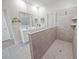 Modern bathroom featuring a glass-enclosed walk-in shower and double sink vanity at 7149 Dilly Lake Ave, Groveland, FL 34736