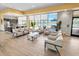 Bright clubhouse sitting area with comfortable seating and views of the outdoor pool area at 7149 Dilly Lake Ave, Groveland, FL 34736