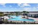 Large community pool with surrounding lounge chairs at 7149 Dilly Lake Ave, Groveland, FL 34736