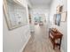 Inviting entryway offers a glimpse into the spacious living area and features tasteful decor and tile flooring at 7149 Dilly Lake Ave, Groveland, FL 34736