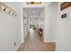Inviting hallway with wood flooring and views into the living room at 7149 Dilly Lake Ave, Groveland, FL 34736